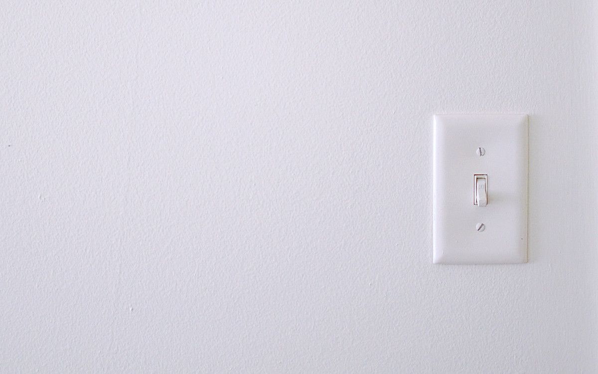 Disconnecting from internet distractions when working remotely is represented by a switch. Photo by twinsfisch on Unsplash.