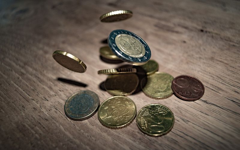 Coins represent a passive income. Photo by Skitterphoto from Pexels